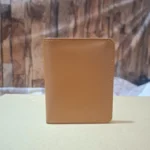 Open tan leather card wallet with visible ID window and card slots wolveyes