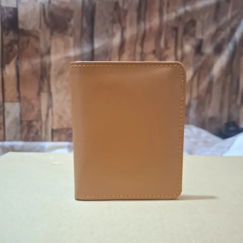 Open tan leather card wallet with visible ID window and card slots wolveyes