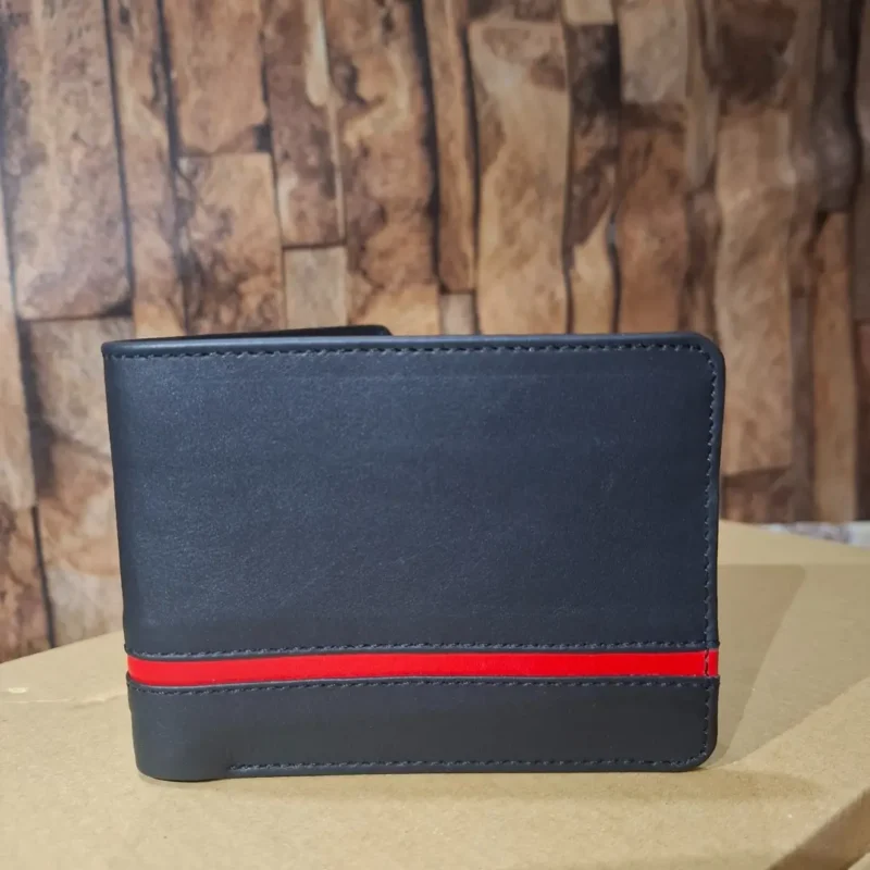 Premium black leather wallet placed on a beige surface with stylish red stripe
